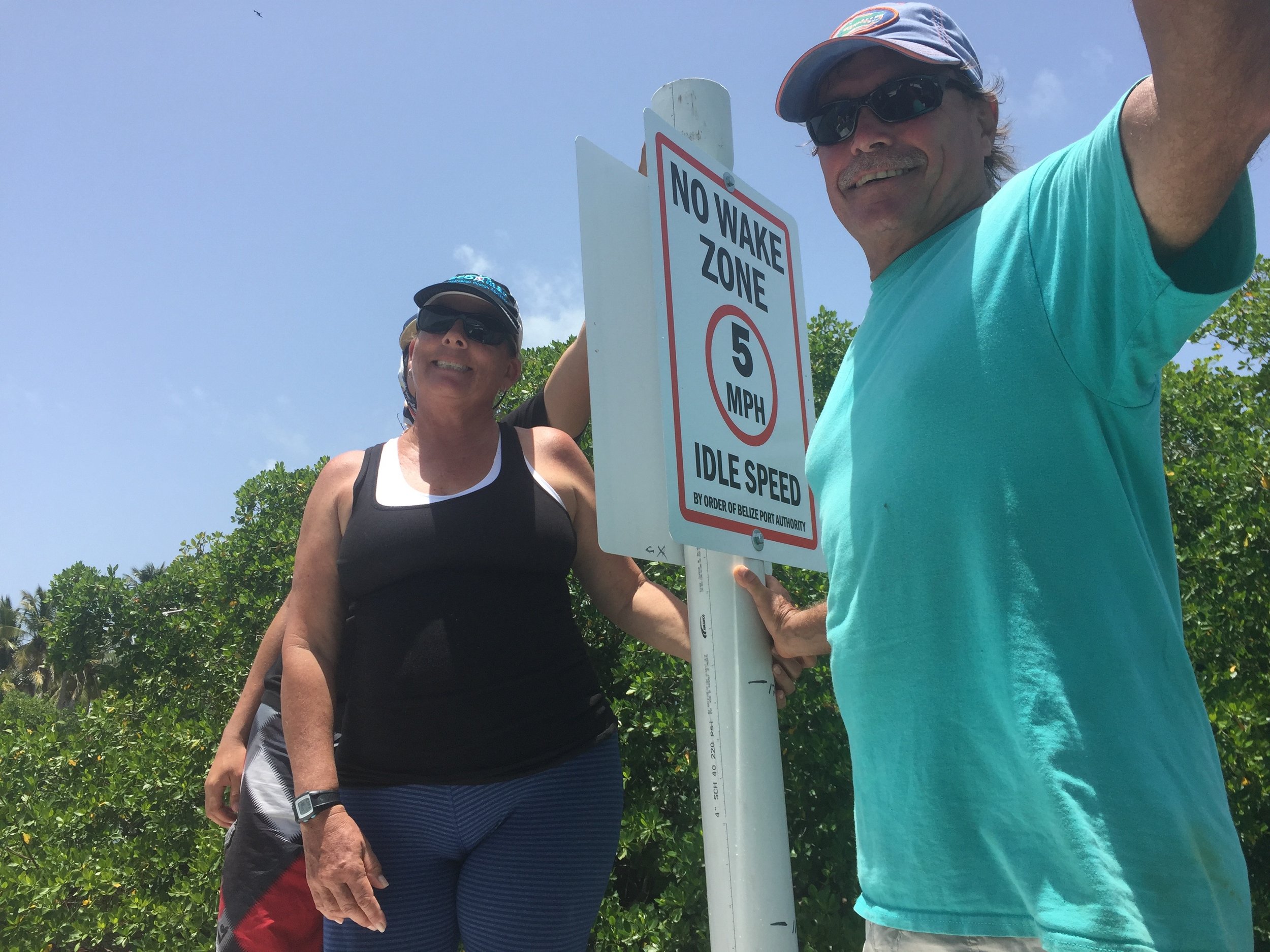 Linda &amp; John Searle of EcoMar with the new speed limit signs that will reduce manatee injuries